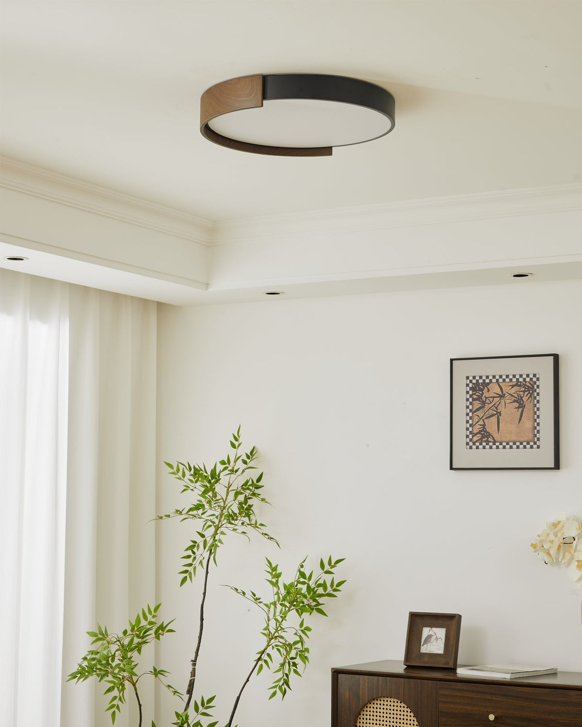 Unlit view of the Claxy ceiling light against a white ceiling.
