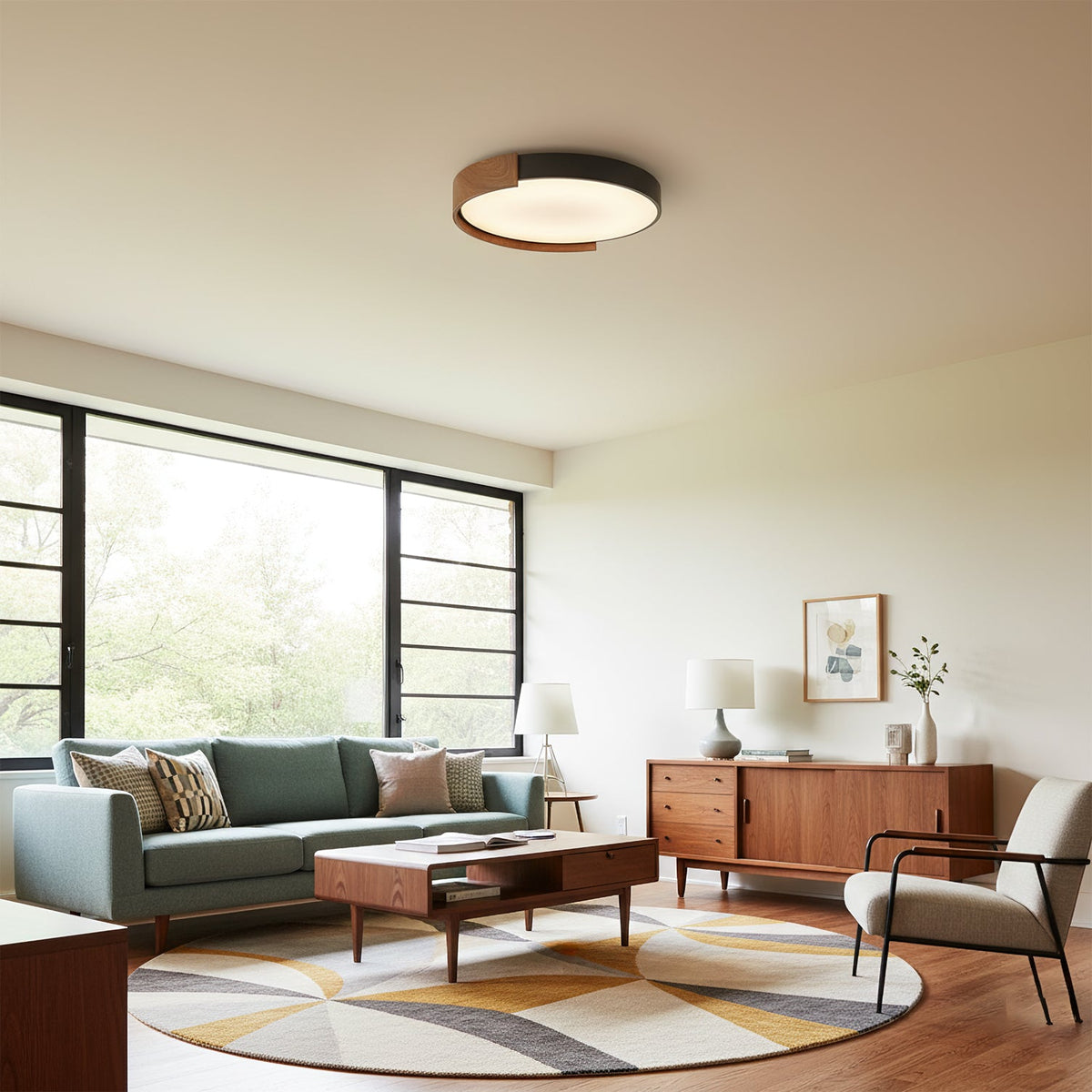 Claxy ceiling light shown illuminated in a modern living room.