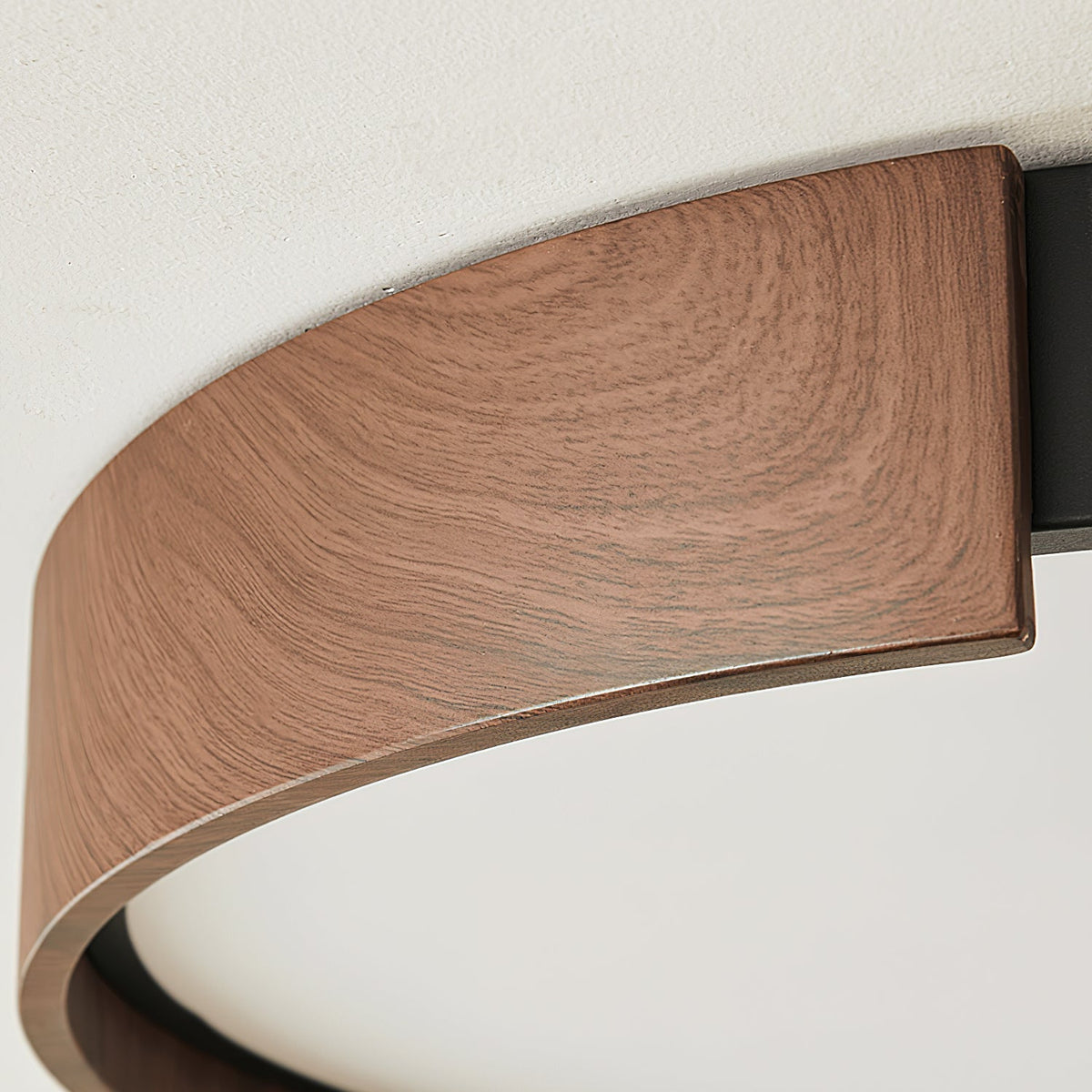 The walnut wood finish detail of the Claxy ceiling light.