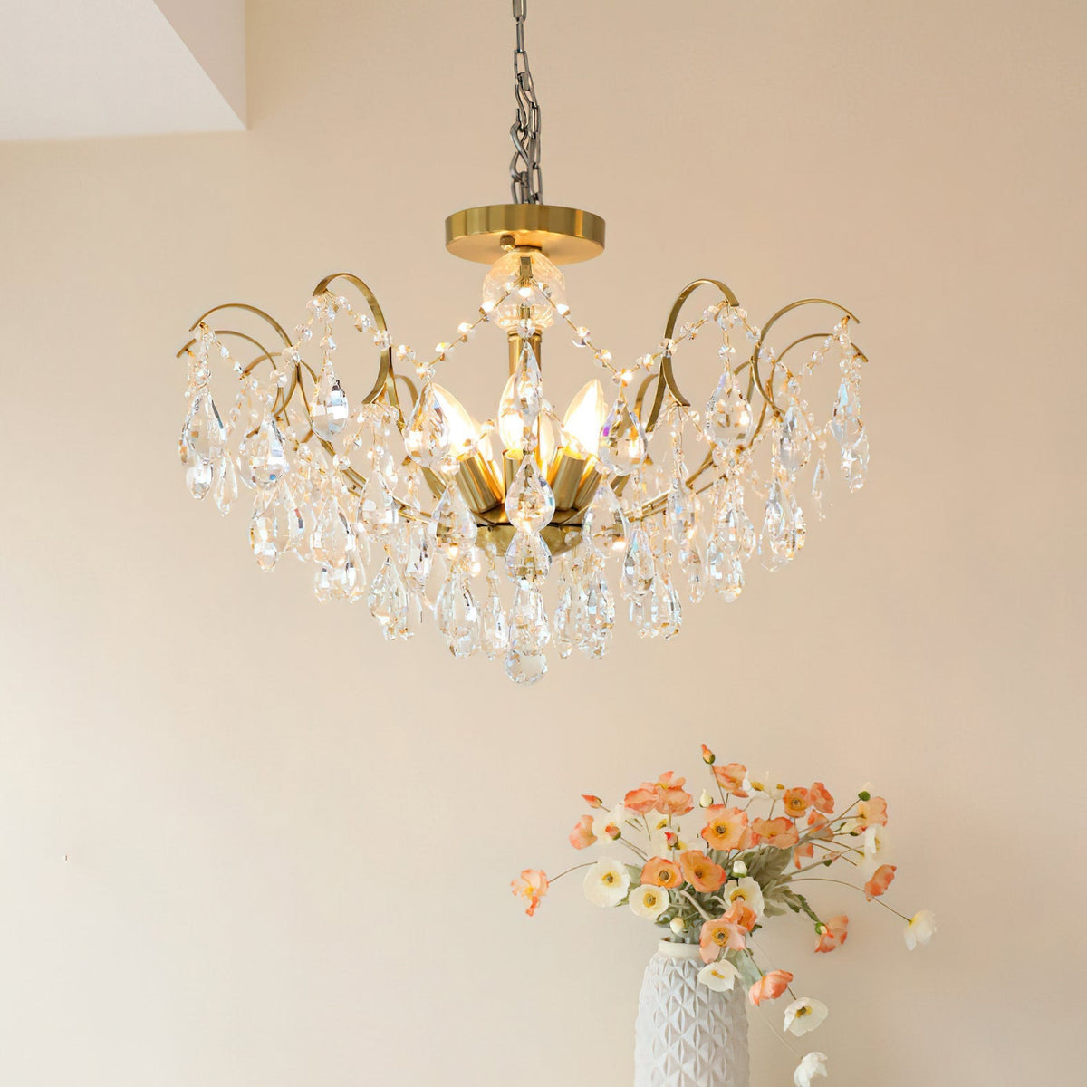 The chandelier against a dark background, highlighting the crystal sparkle.