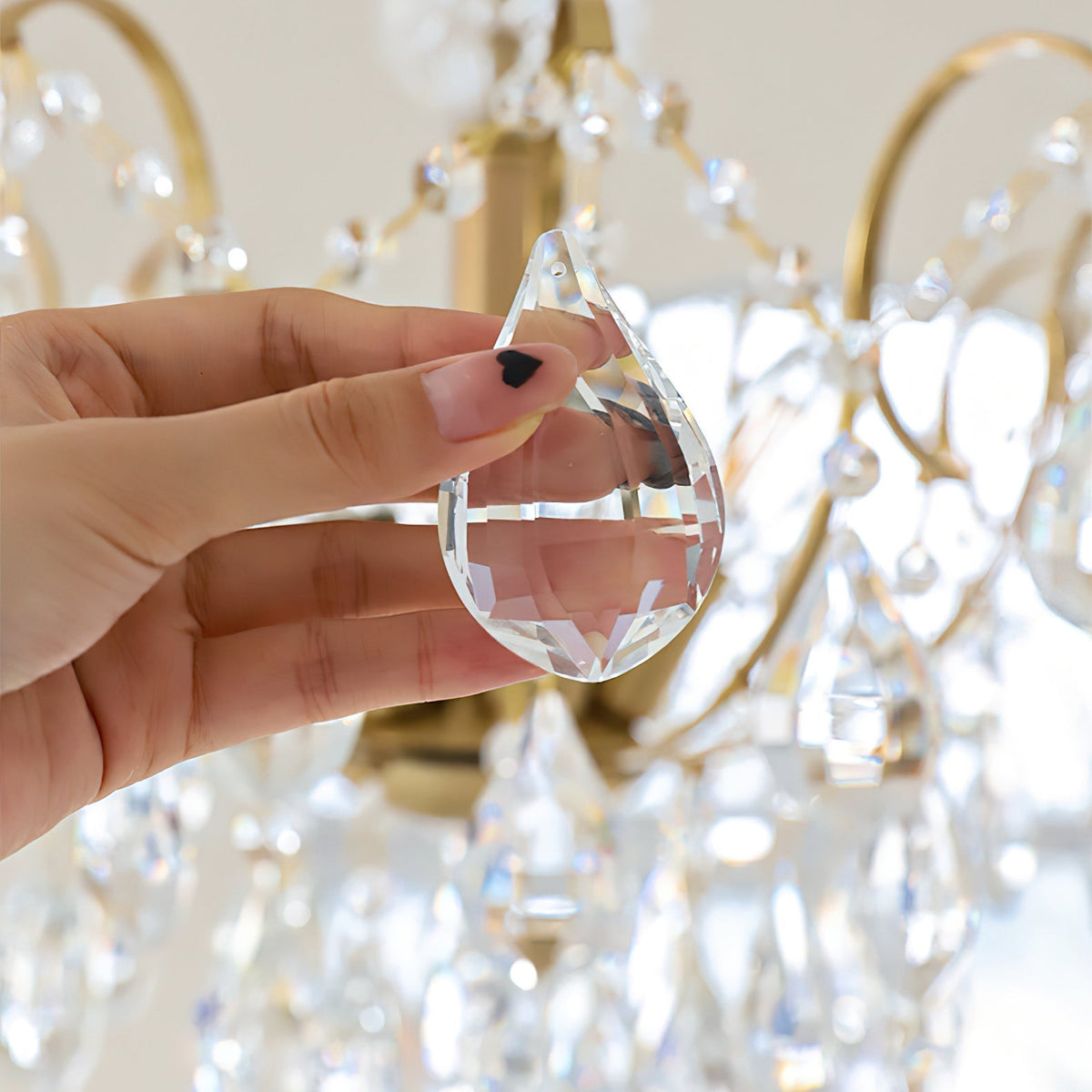 Detail of the gold hanging chain and ceiling mount.