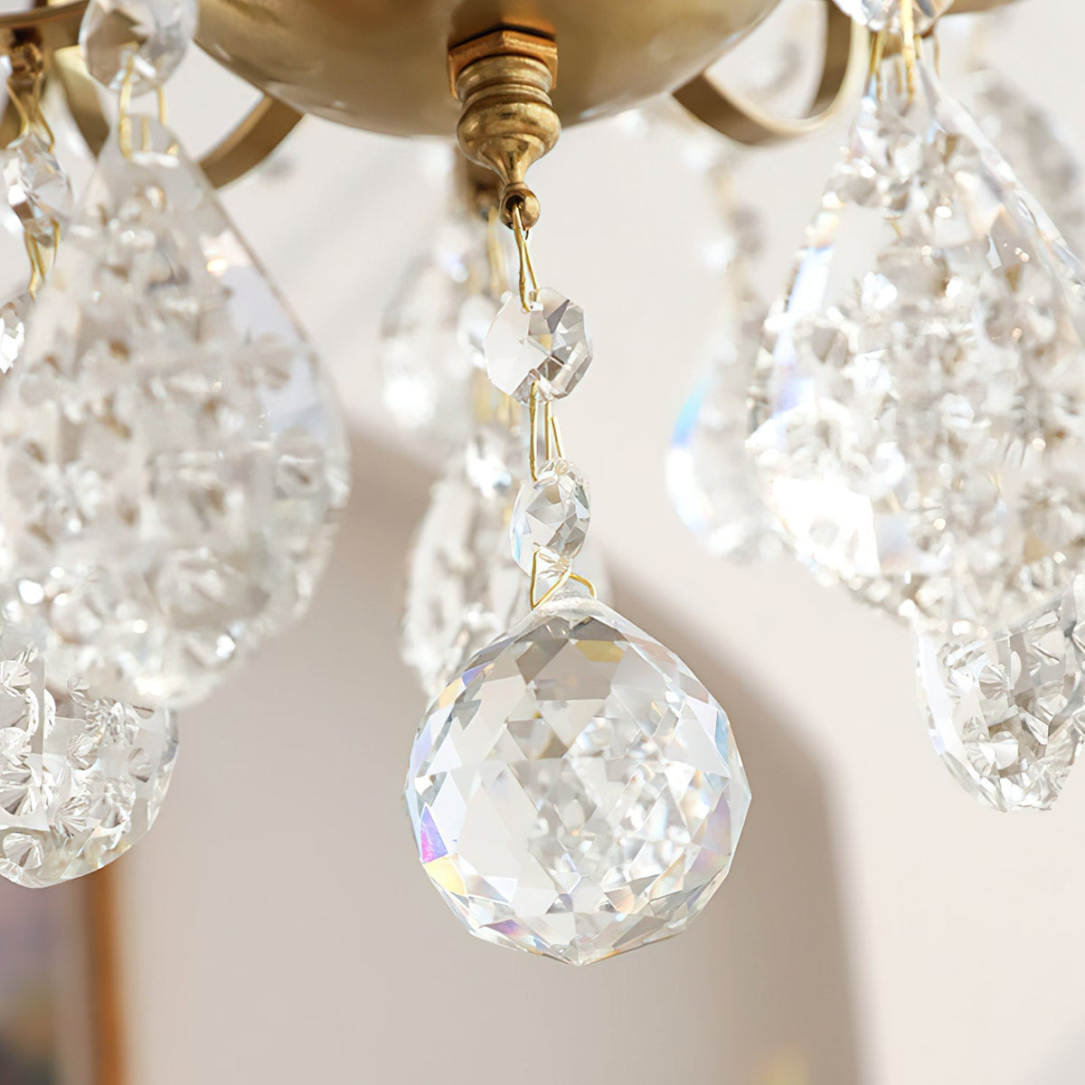 The chandelier unlit, showing the clarity of the crystal prisms.