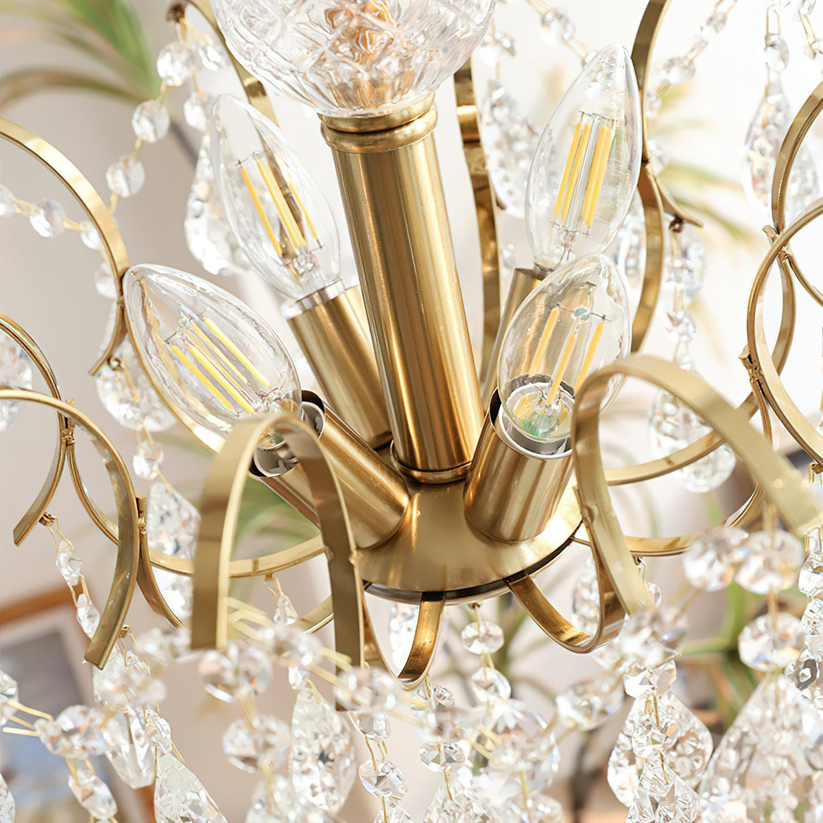 The chandelier casting light patterns on the ceiling.
