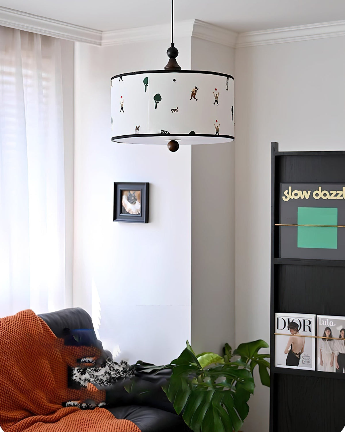 Congo Pendant Light illuminated, casting a warm glow.