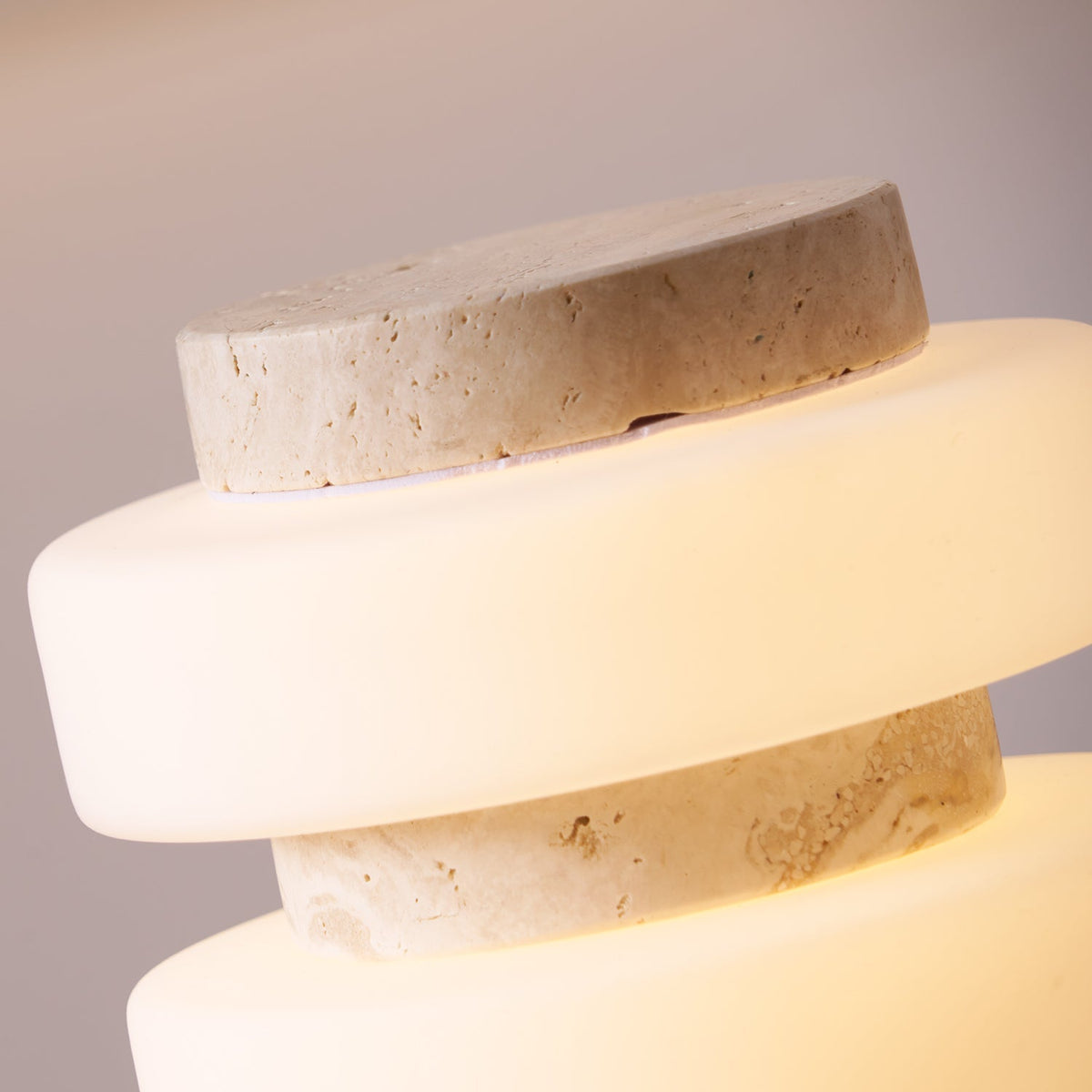 The sculptural form of the Corba Table Lamp in beige.