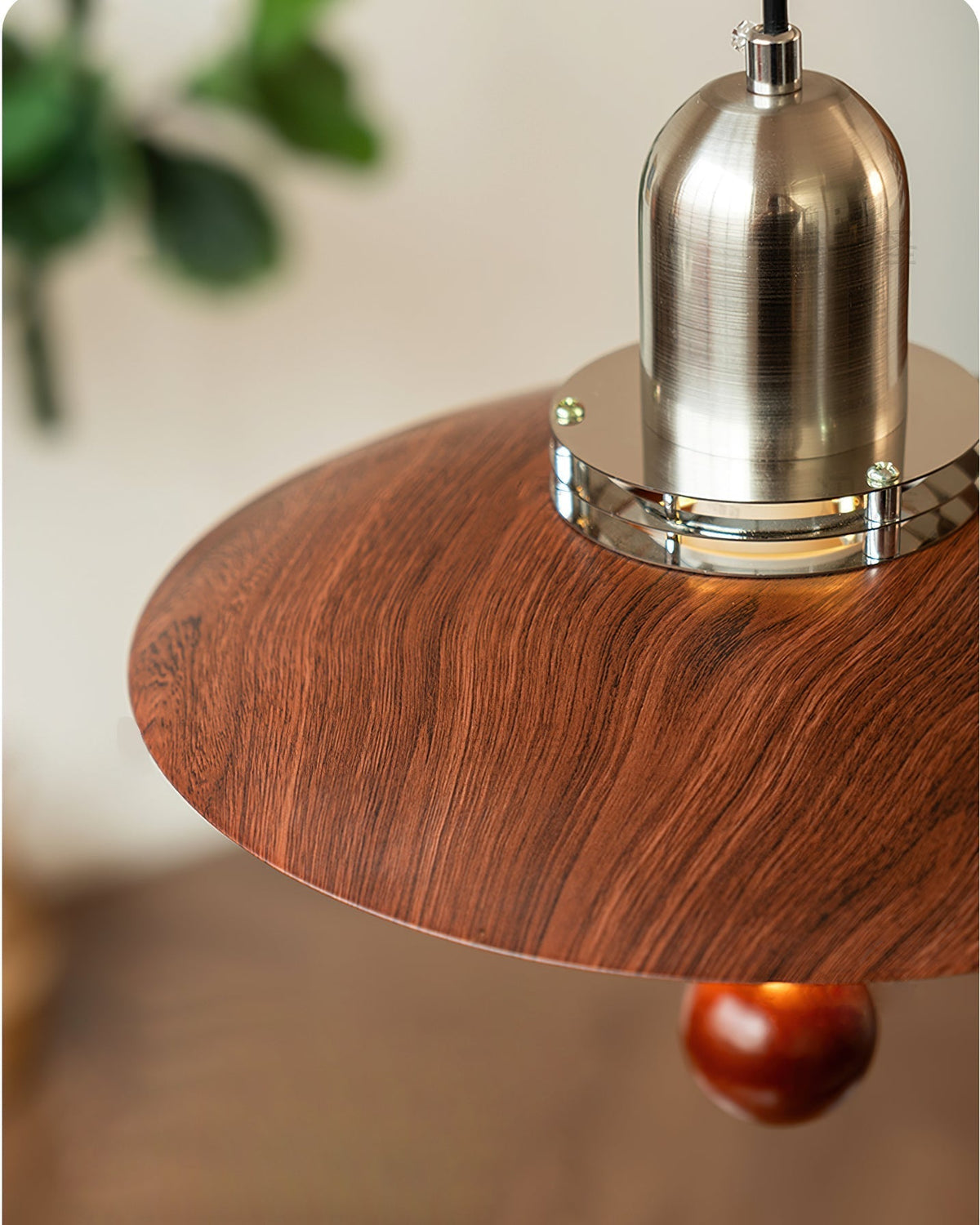 The Cullen Pendant Light displayed in its walnut and nickel finish.