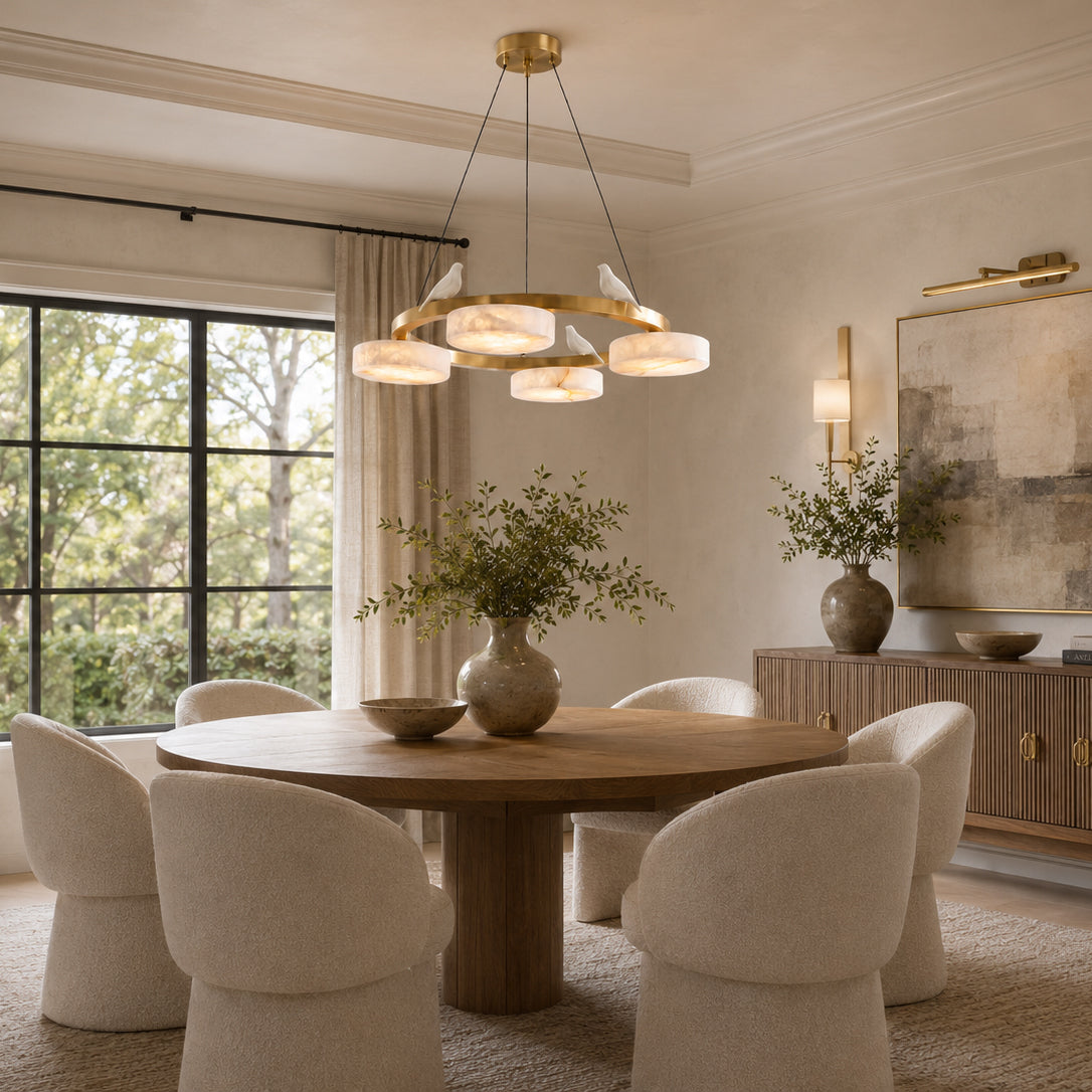 The Sienna chandelier lit, showing the warm glow through the alabaster.