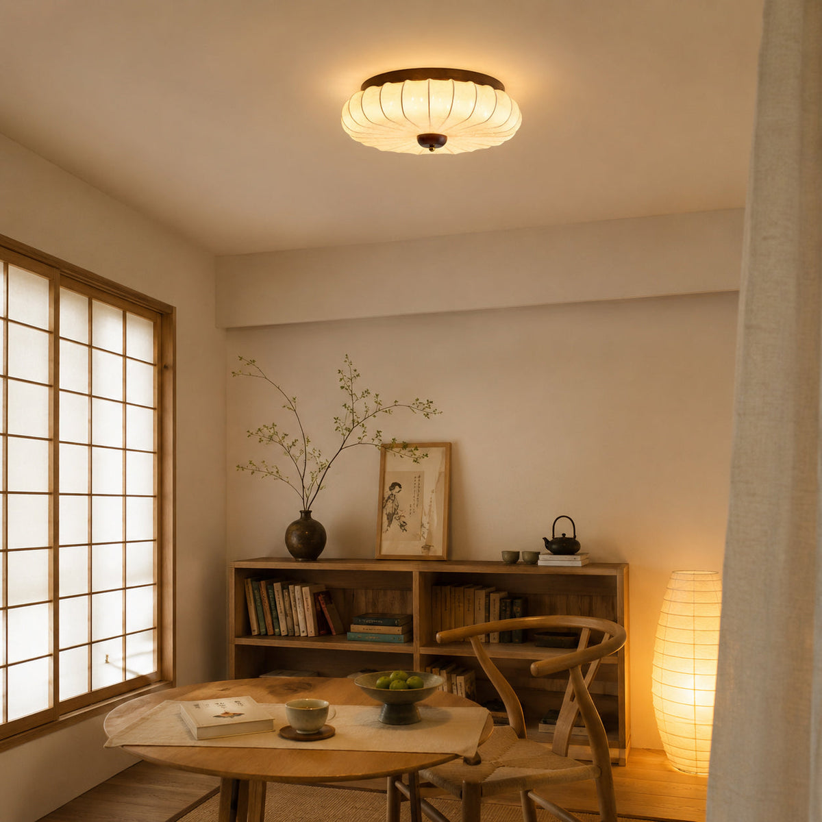 The flush mount light turned on, showing a warm ambient glow.