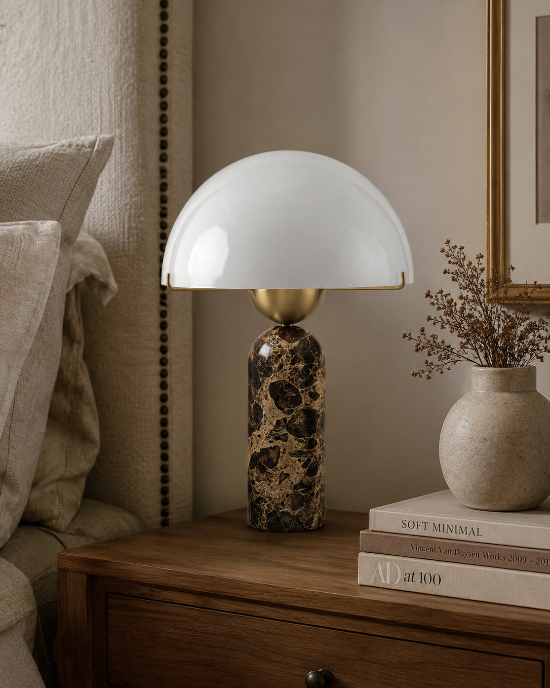 The lamp placed in a modern entryway on a console table.