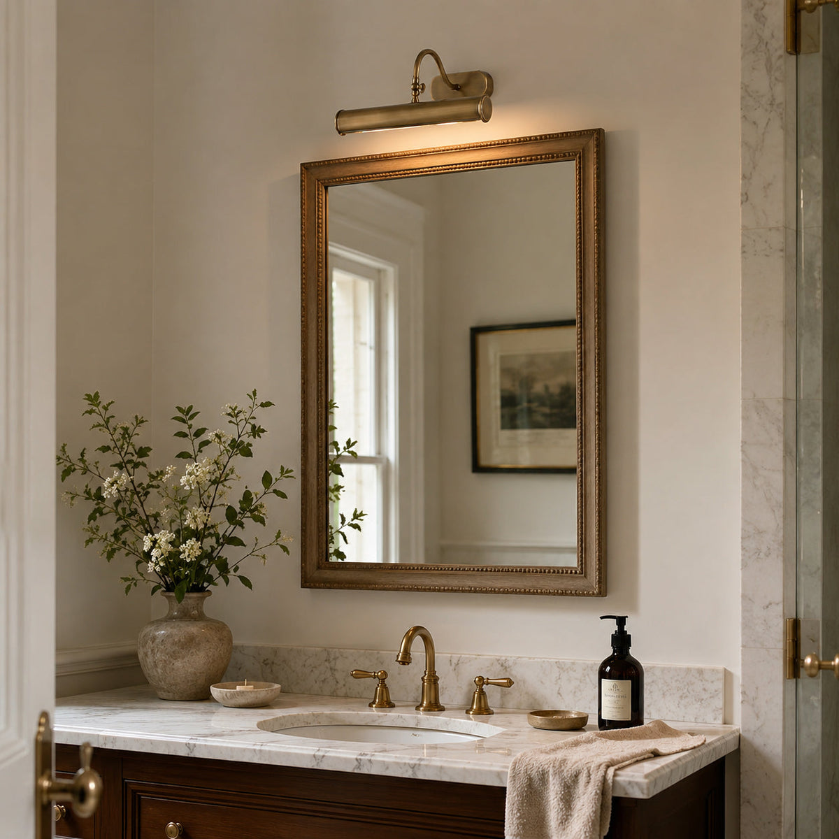 Detail shot of the clean-lined end cap of the Ainsworth Brass Wall Sconce.