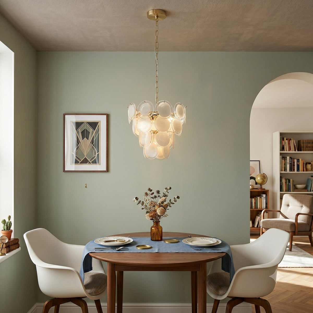 The pendant light in a dining room setting over a table.