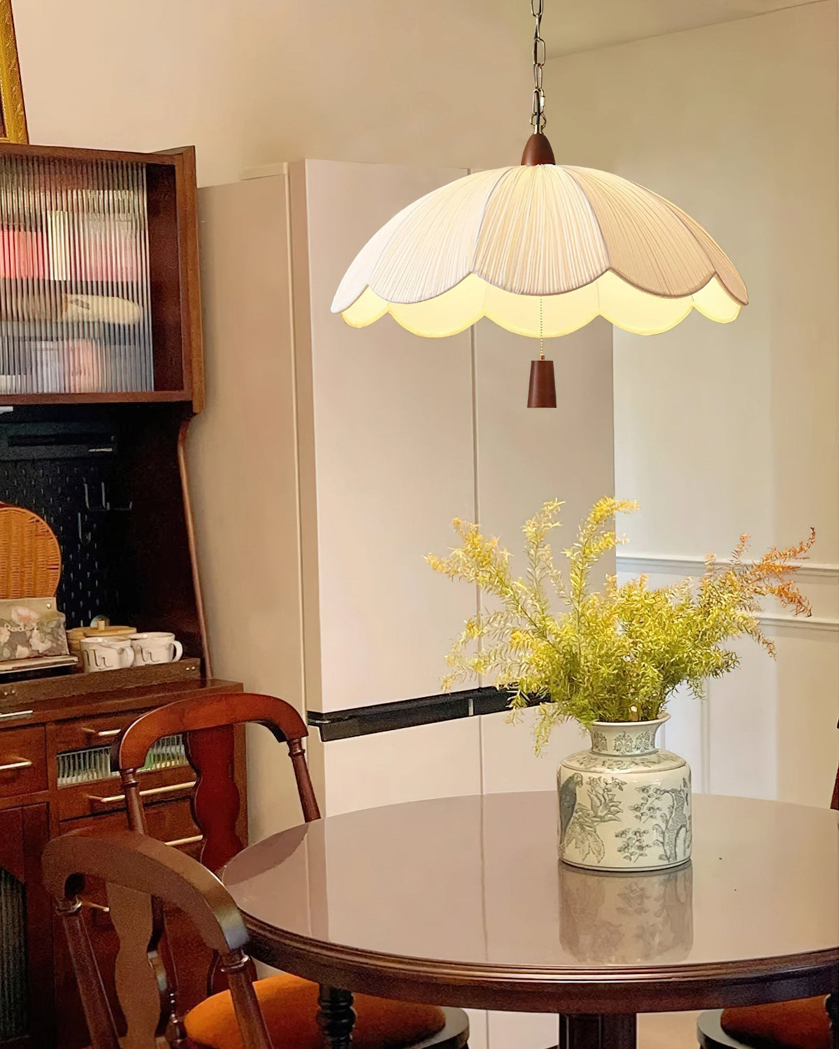 The Dawson Pendant Light in a bedroom setting, providing warm ambient light.