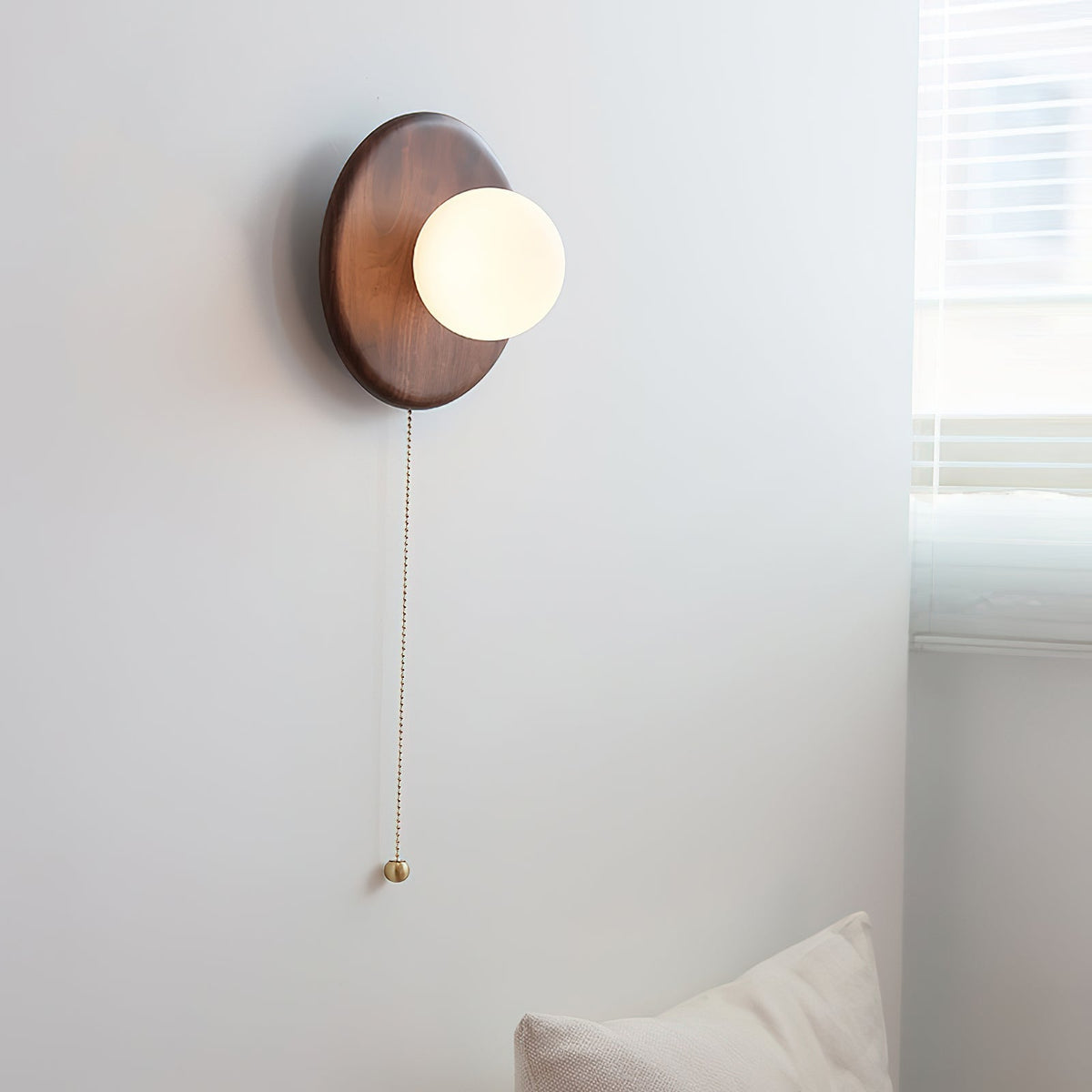Angled view of the Abel wall sconce highlighting its geometric form.