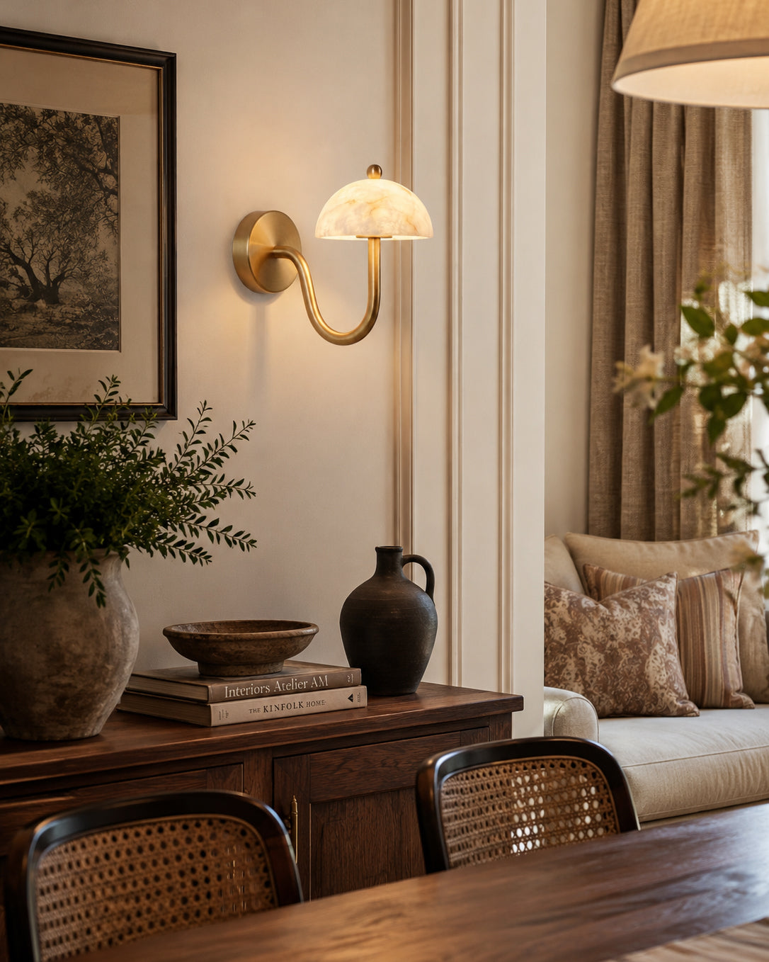 A pair of Ripple Alabaster Wall Sconces used as bedside reading lights.