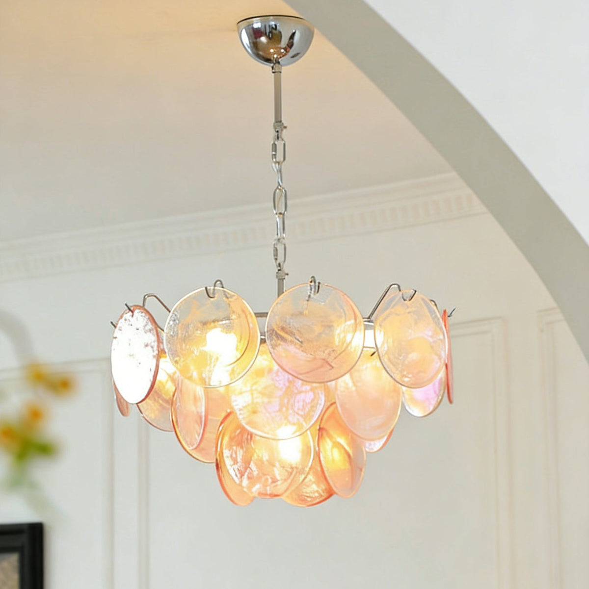 The Brette chandelier shown with blue iridescent glass disks.