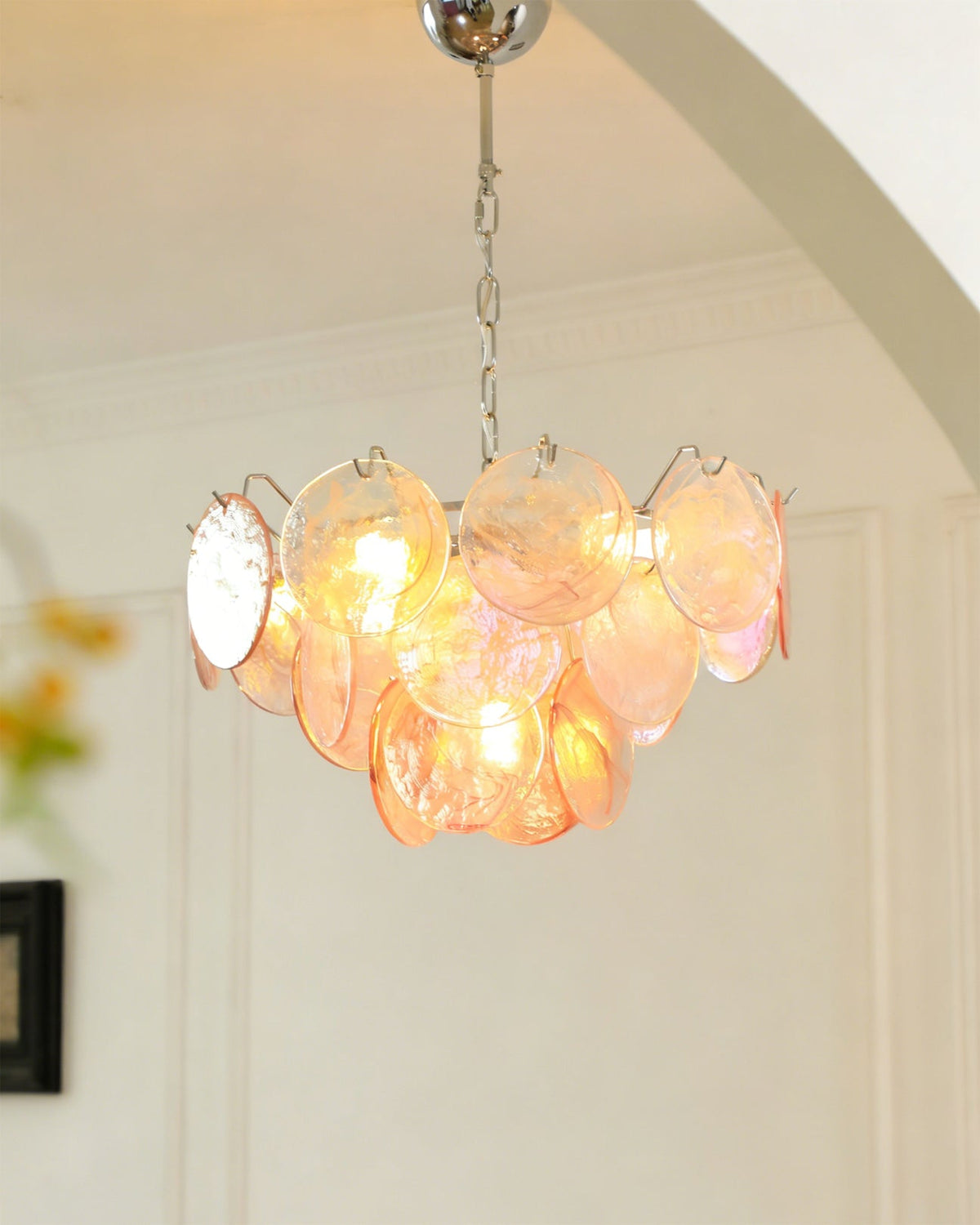 The Brette chandelier shown with green iridescent glass disks.