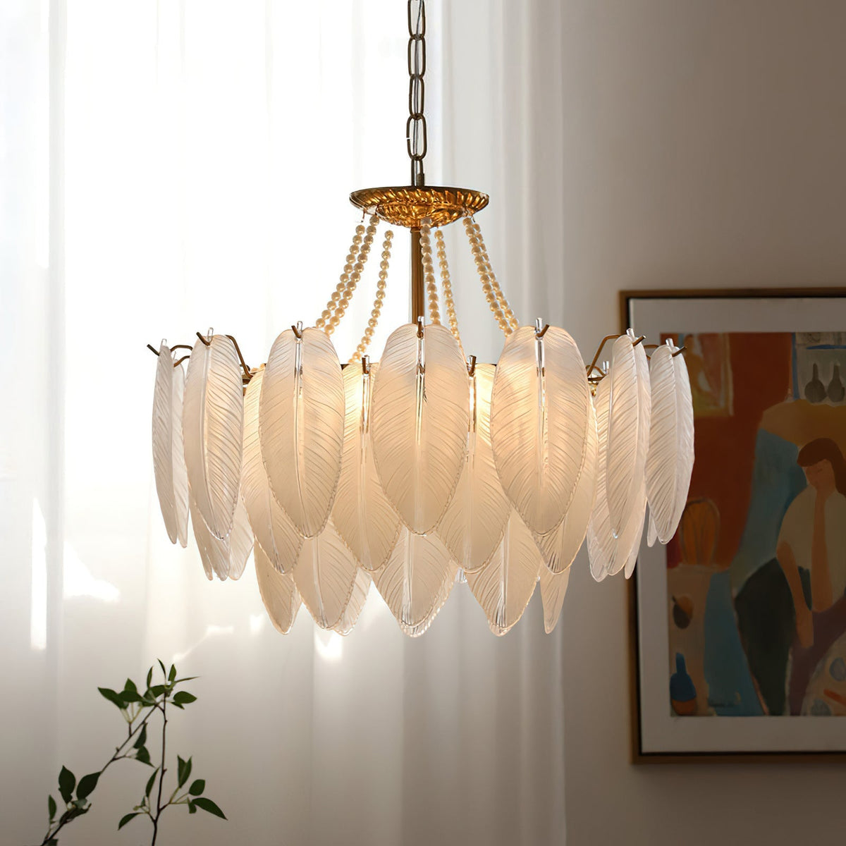 Detail of the warm gold finish on the chandelier's metal frame.