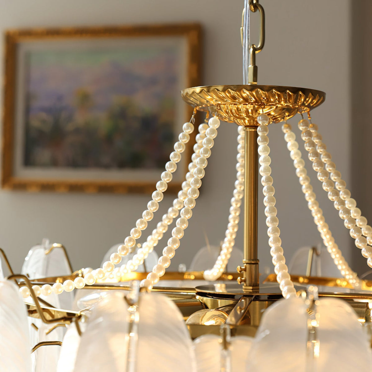 The botanical-inspired design of the Antheia Chandelier's glass plumage.