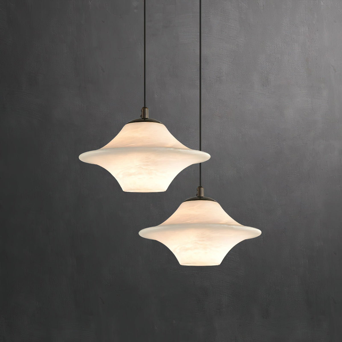 Multiple Beckett pendant lights styled over a modern kitchen island.