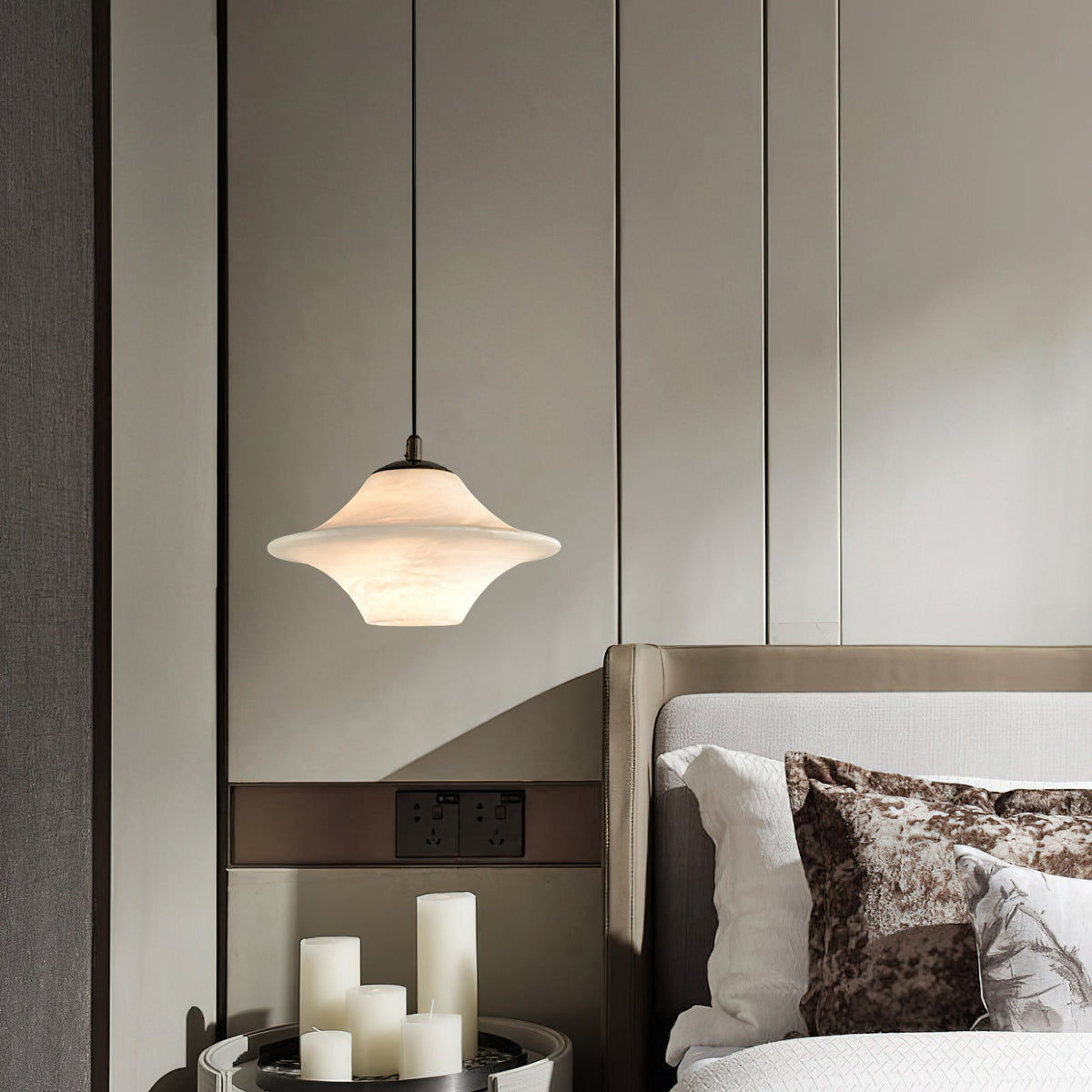 The pendant light illuminated, showing a warm, diffused glow.