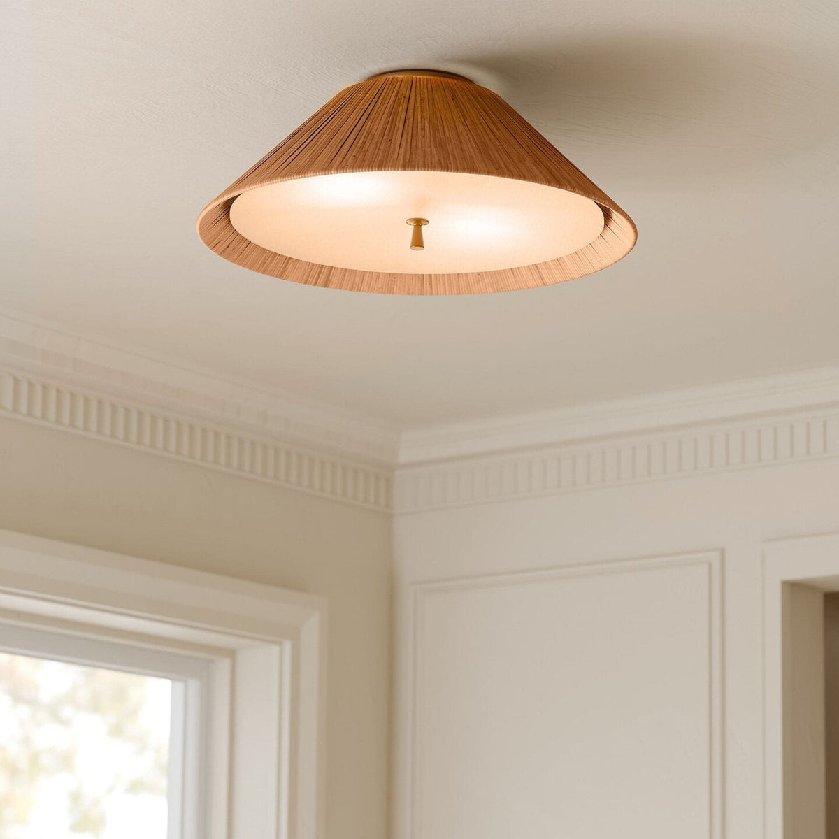 Close-up of the woven rattan shade of the Bodie Ceiling Mount.