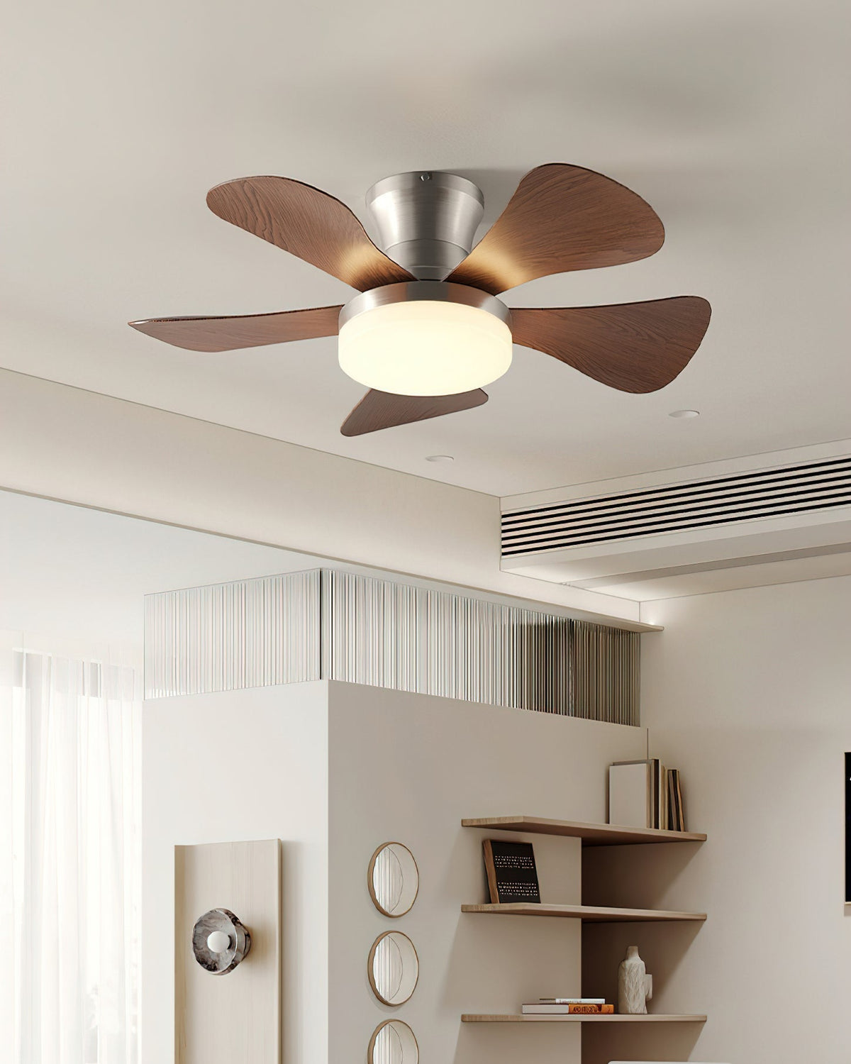 Hand holding the remote control for the Brennan Ceiling Fan Light.