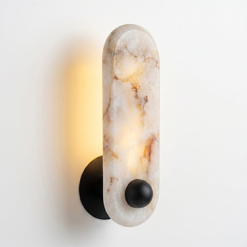 Angled view of the elongated capsule-shaped alabaster plate.