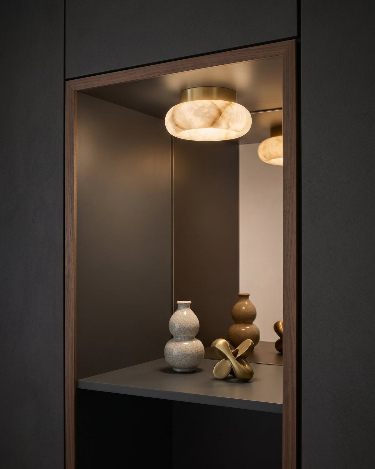 The Cairns lamp shown in a modern bedroom setting.