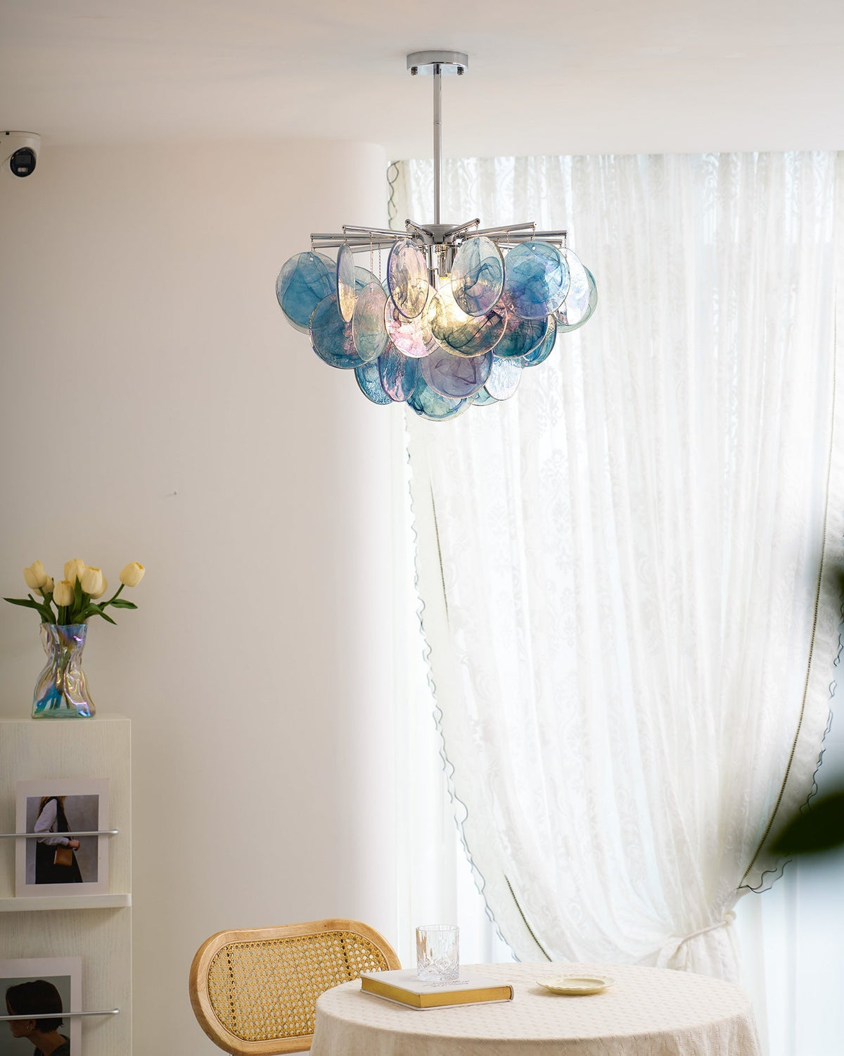 The chandelier shown with contemporary furniture.