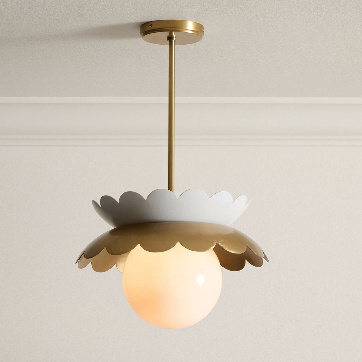 Lifestyle image featuring the Capri Globe Pendant Light in a nursery setting.