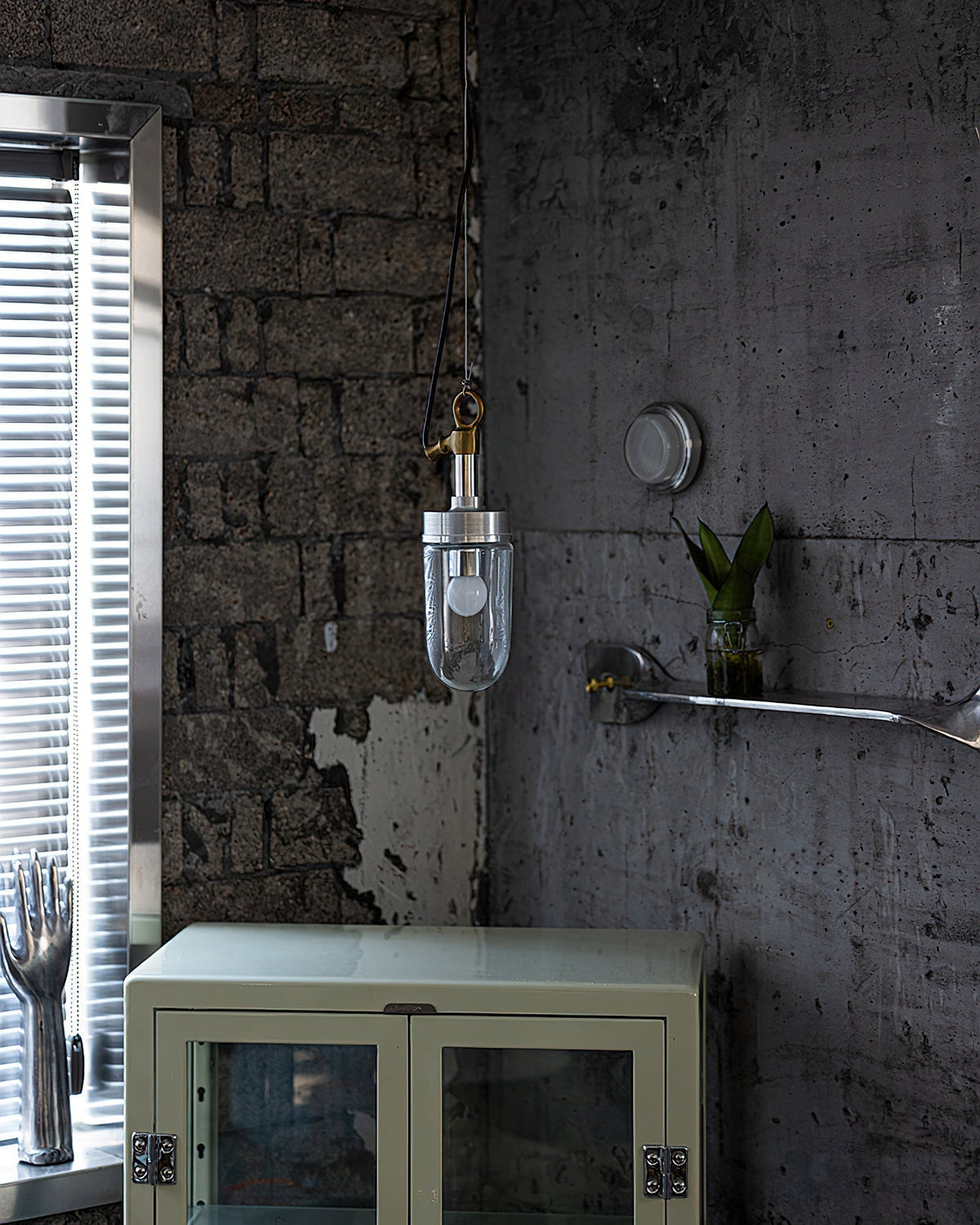 Carson Capsule Pendant Light illuminated, showcasing its warm glow.