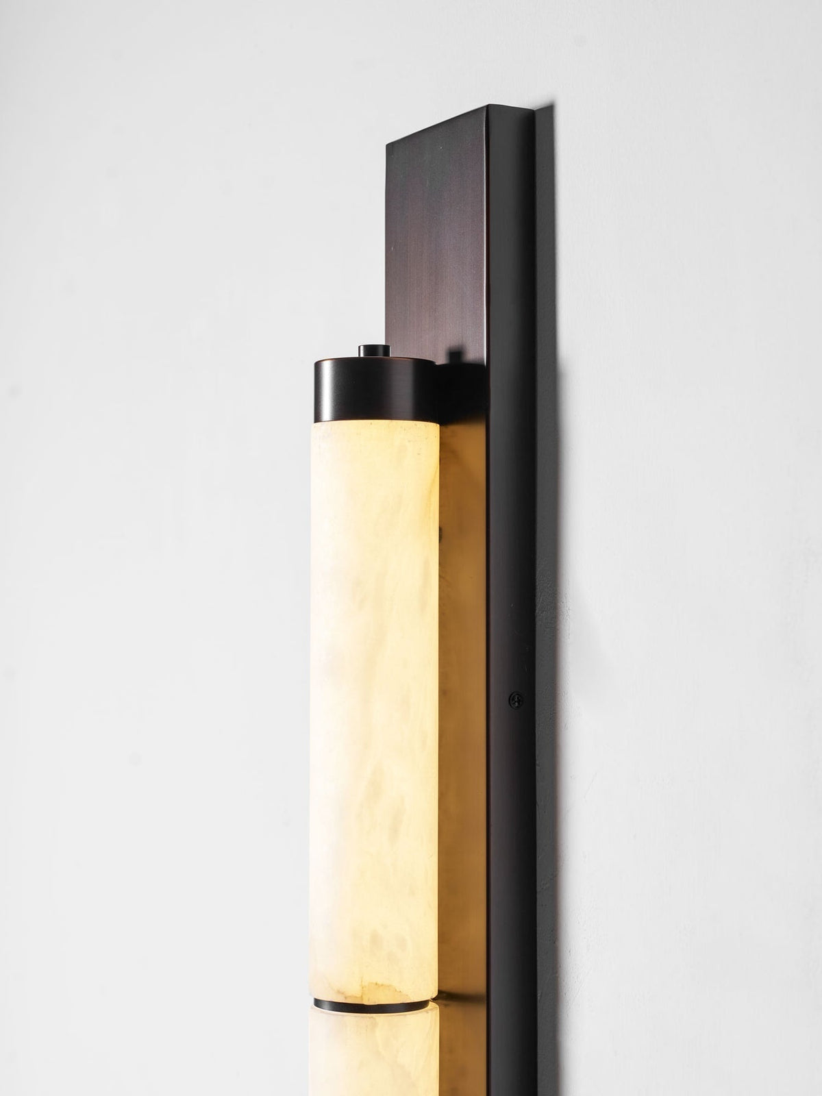 The Columnar Alabaster Wall Lamp with brass finish.