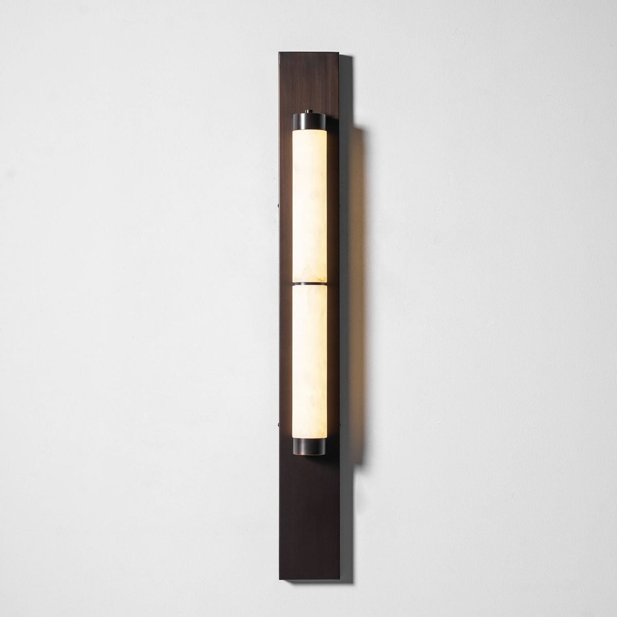 Angled view of the Columnar Alabaster Wall Lamp.