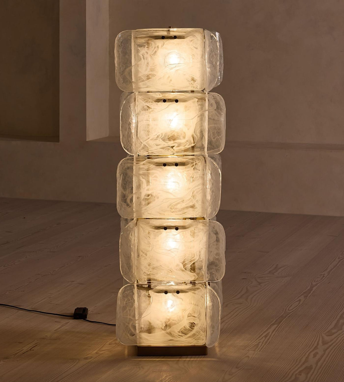 The lamp's base and integrated foot switch on the cord.