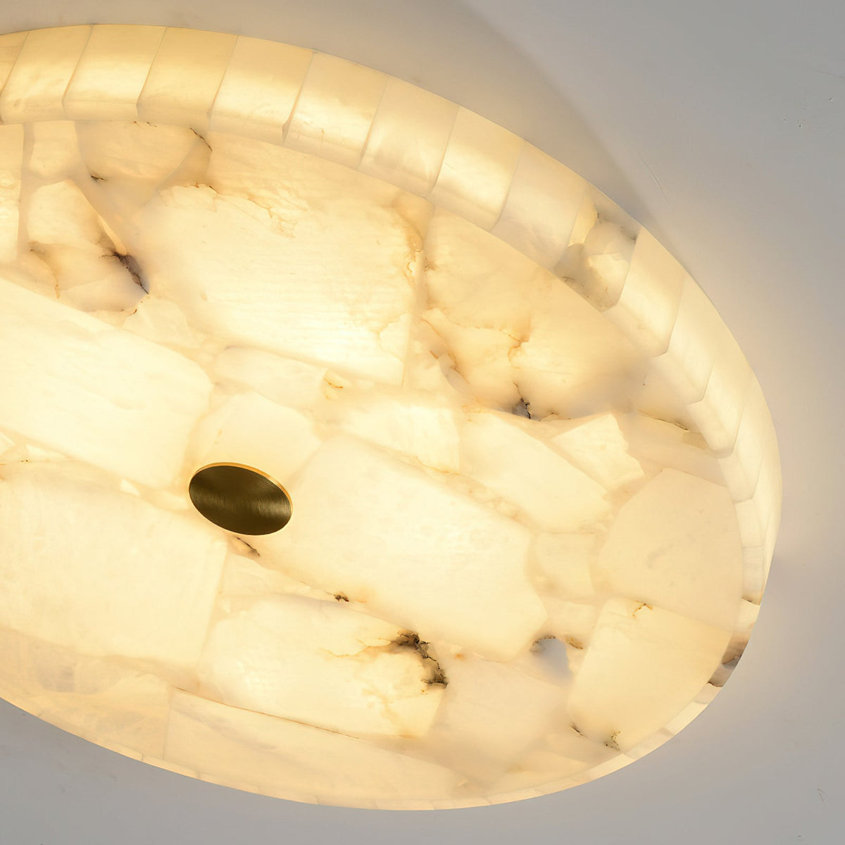 The warm, diffused light from the integrated LED through the alabaster.