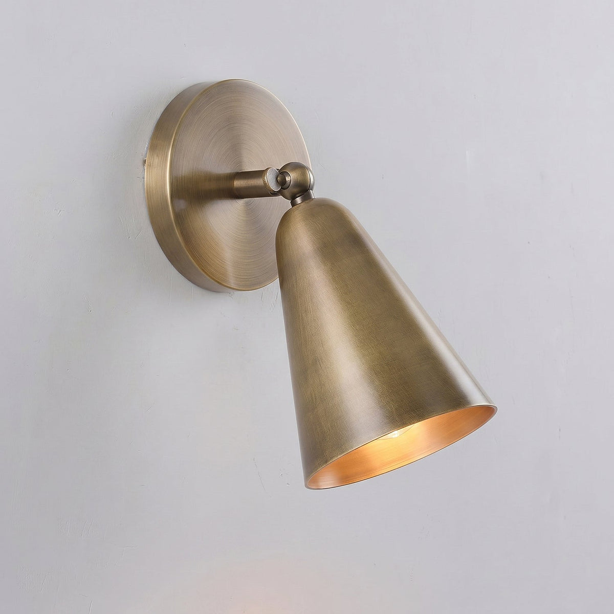 Donna Swivel Sconce in black finish, tilted downwards.