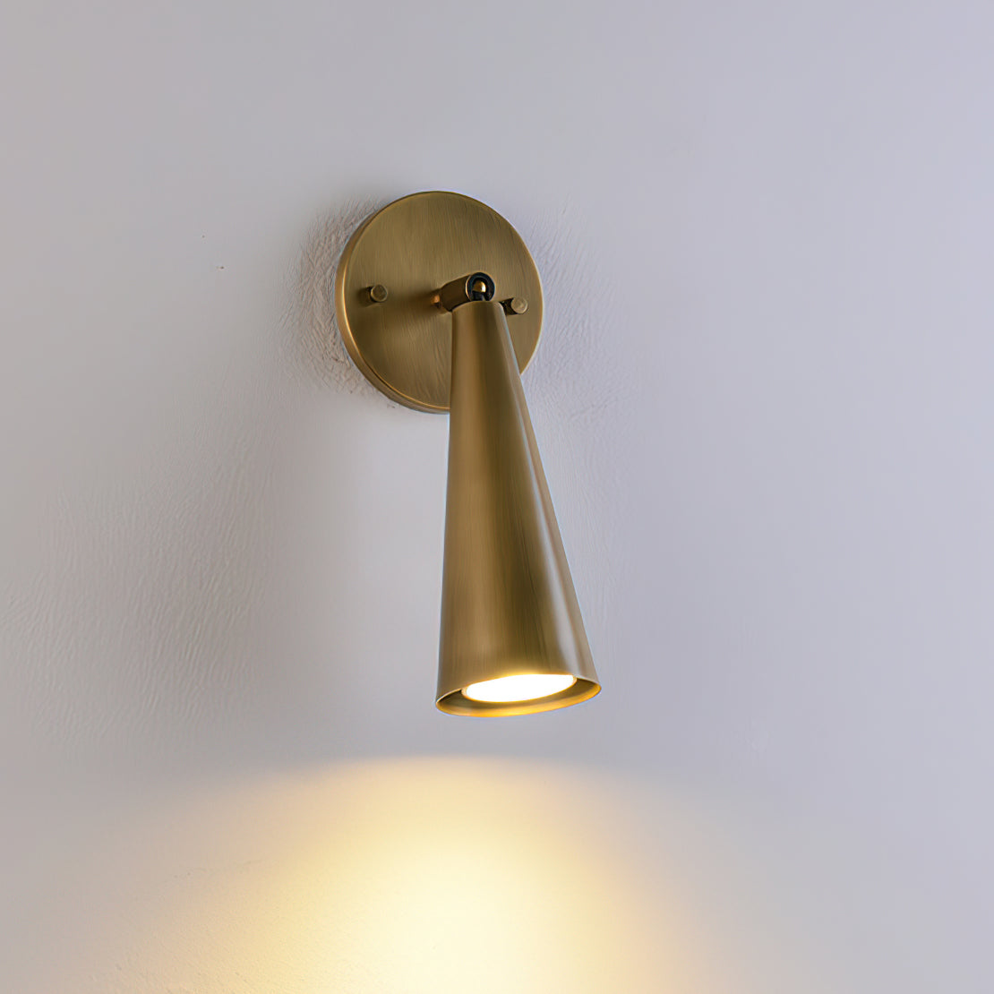 Another view of the sconce in a cozy bedroom.
