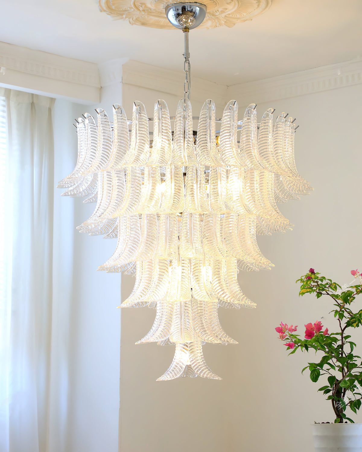 Lifestyle image of the chandelier in a luxurious home setting.