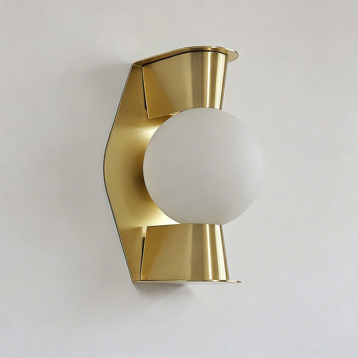 Gale Globe Wall Sconce installed in a modern bedroom above a bedside table.