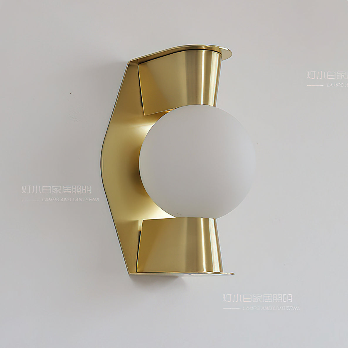 The Gale Globe Wall Sconce turned on, showing the warm halo effect.