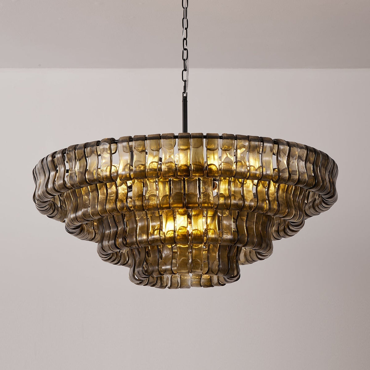 The dramatic effect of the Ghiaccio Chandelier in a luxurious hotel lobby.