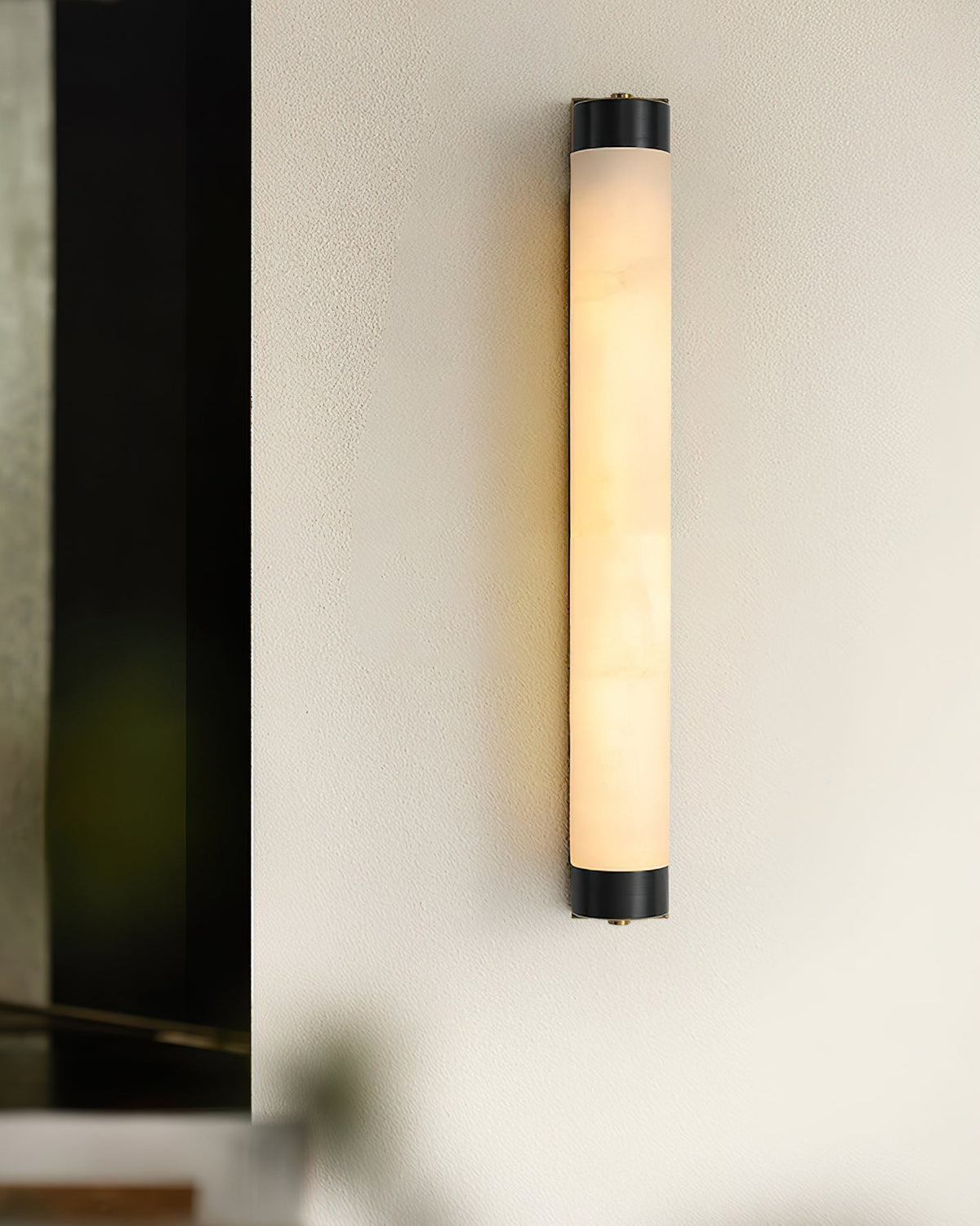 Langham sconce in a transitional living room space.
