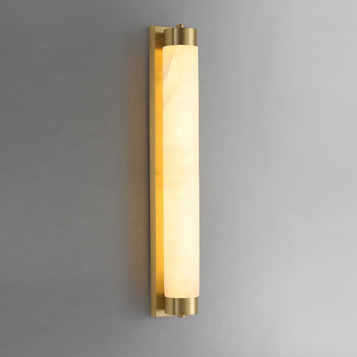 The Langham sconce casting a soft light in an entryway.