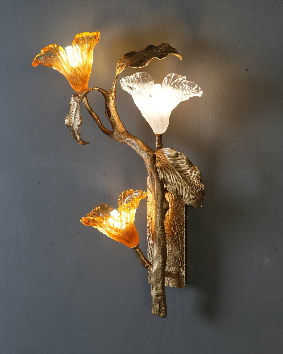 The sconce unlit, emphasizing its artistic, branch-like structure.