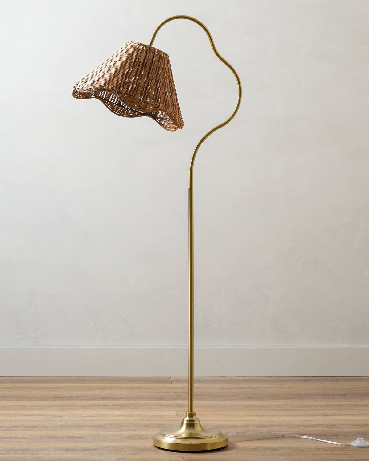 Close-up of the pleated rattan weave on the Lucinda floor lamp's shade.