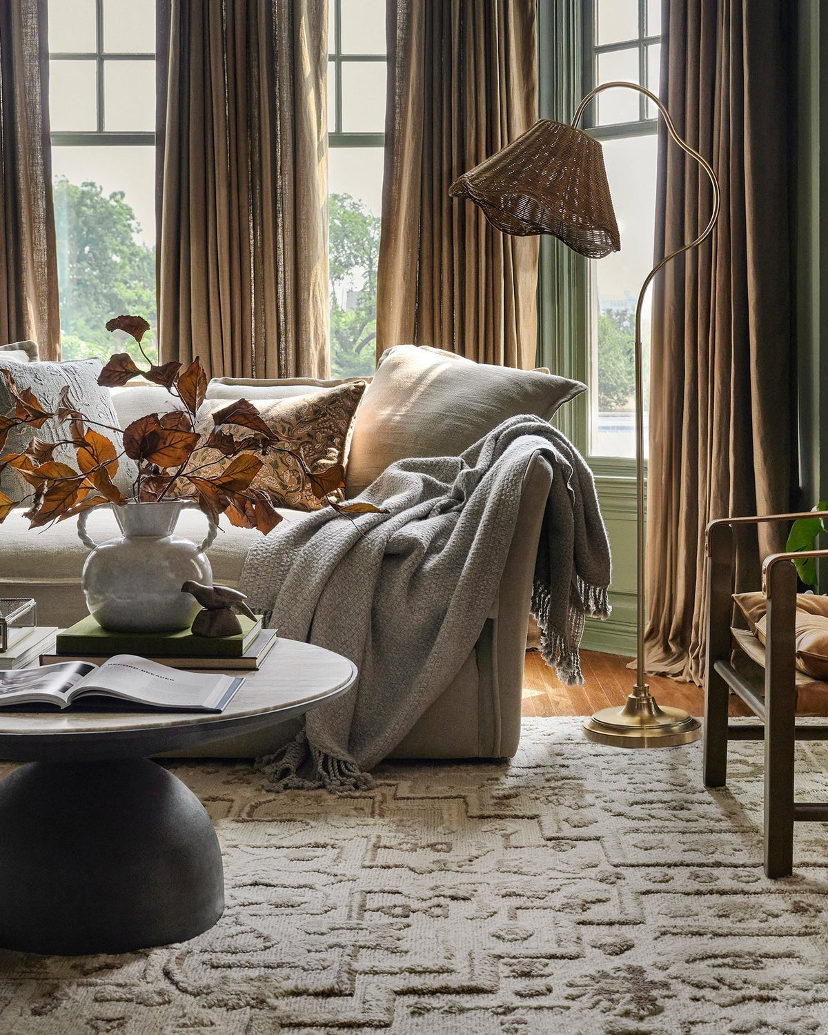 Side profile of the Lucinda Rattan Floor Lamp showing its full height and slender stand.