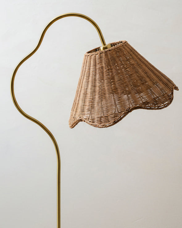 The Lucinda floor lamp illuminating a room, casting a warm, textured glow.