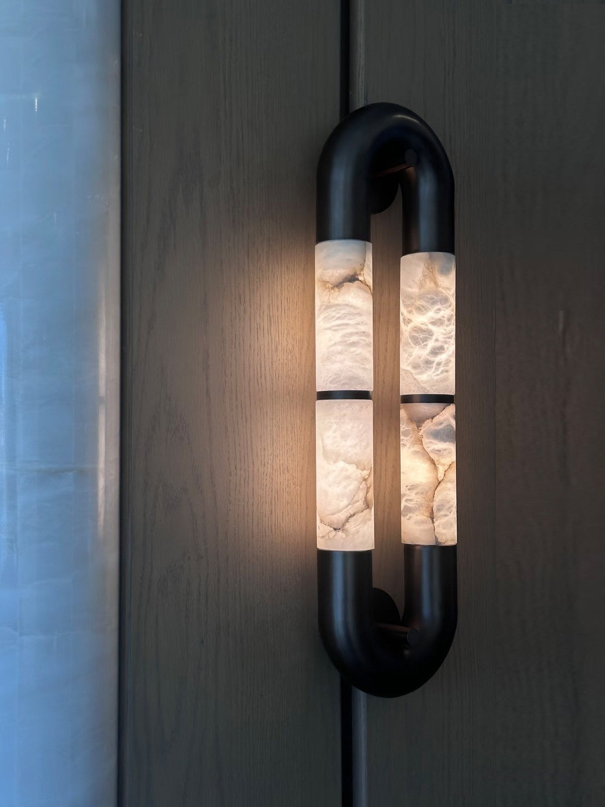 The Mirabelle sconce unlit, highlighting its sculptural form.