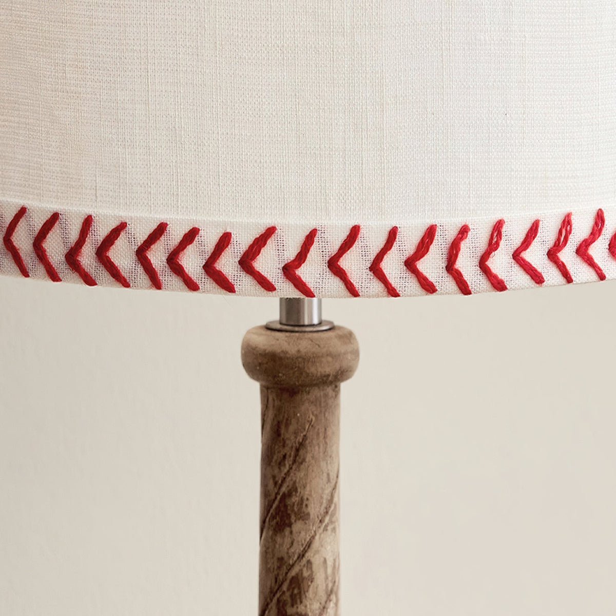 Side profile of the Mitchell Table Lamp highlighting its unique design.