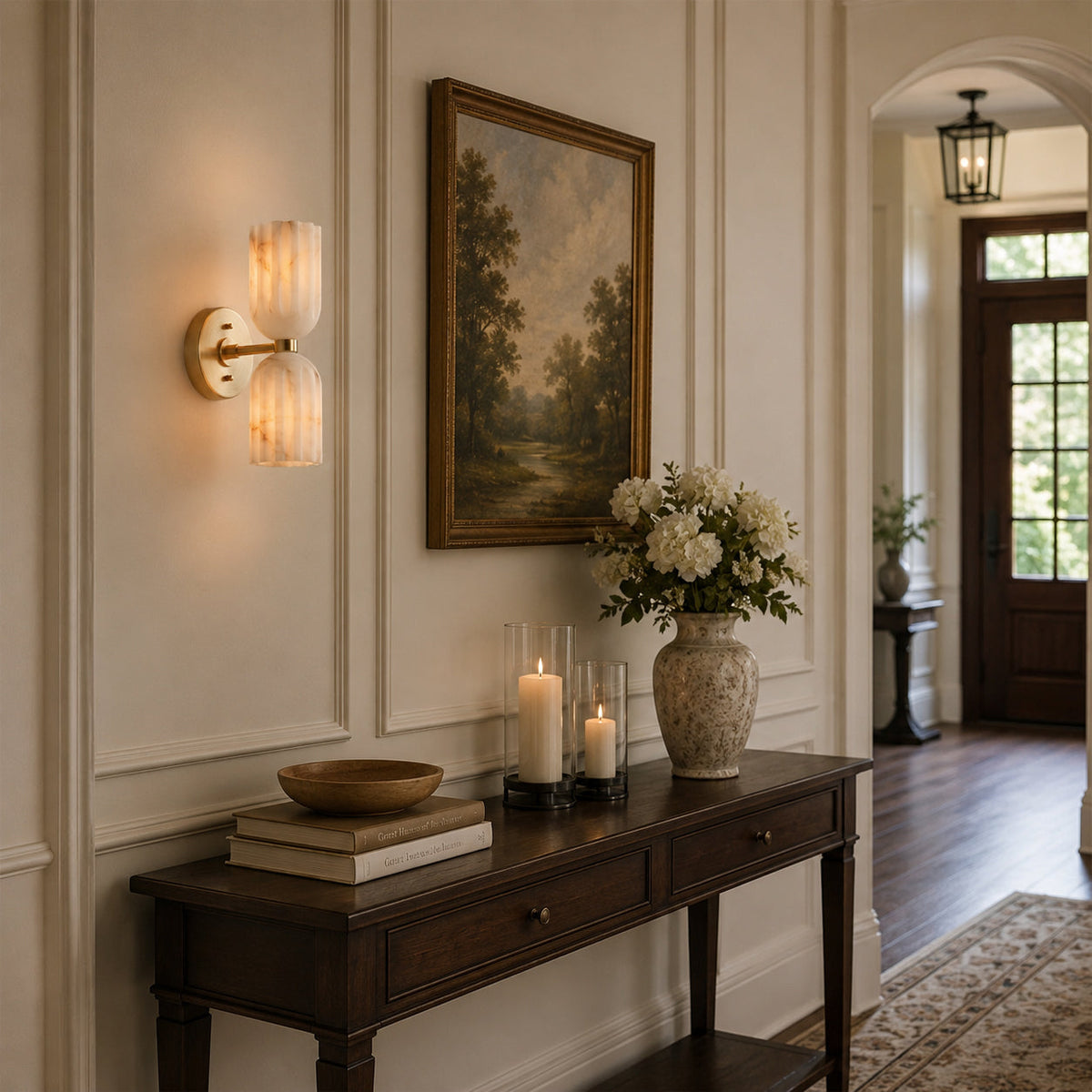 A pair of Piermont Alabaster Wall Sconces illuminating a hallway.